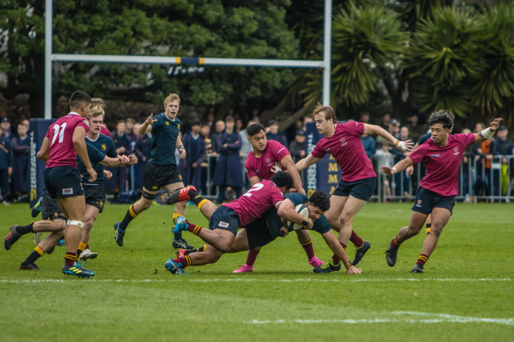 A big tackle during the Grammar vs King's College game