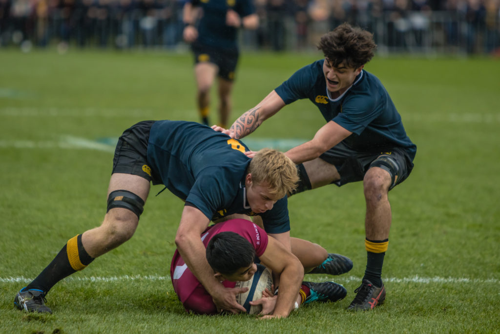 Blake Manning (right) and vice-captain Gage Jackson tackle a King's player