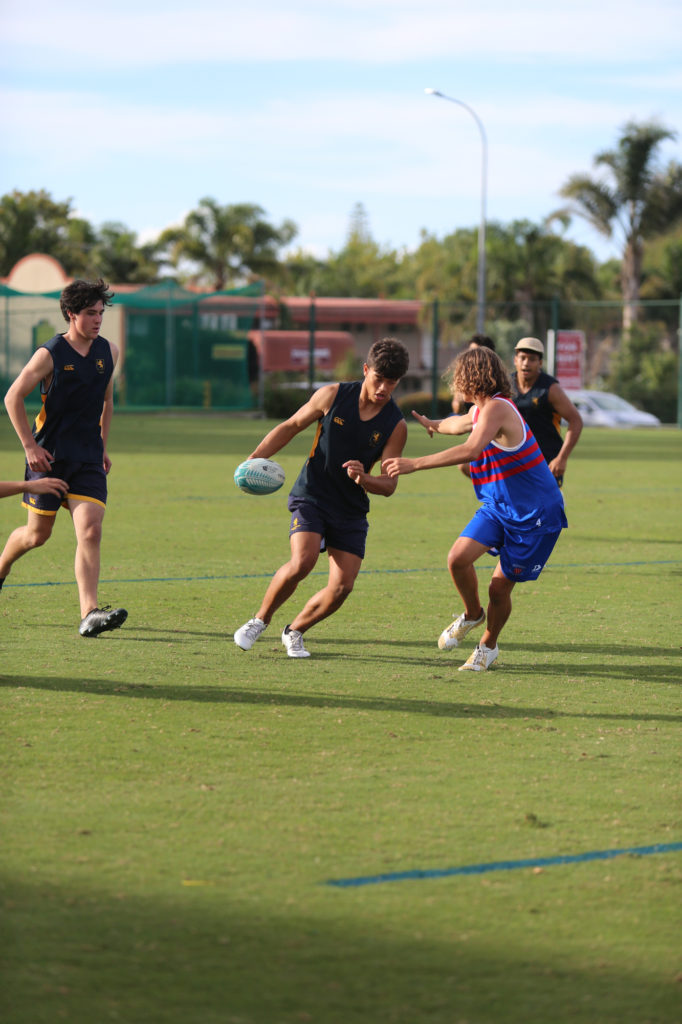 Cullen Gray moves through the Sacred Heart defence