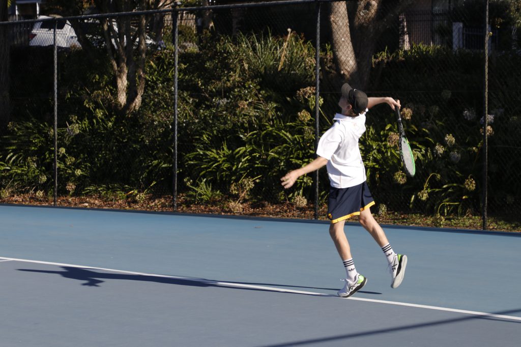 Form 3 student Luca Bland in his singles match