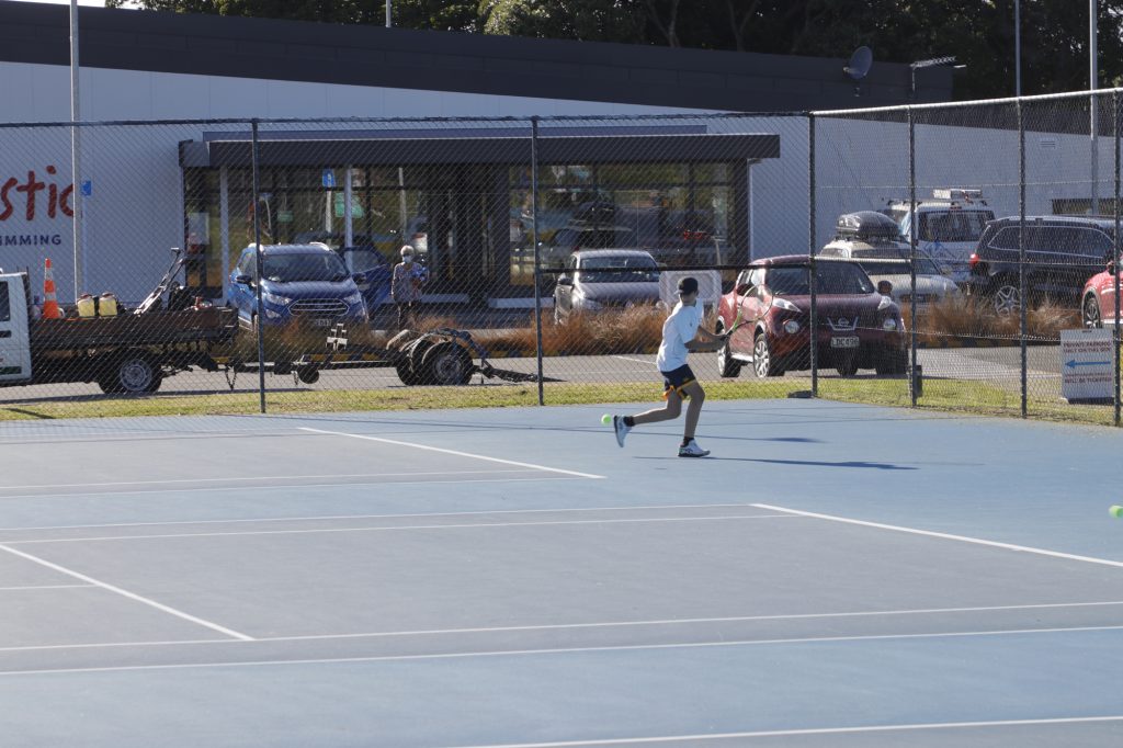 Form 3 student Luca Bland in his singles match