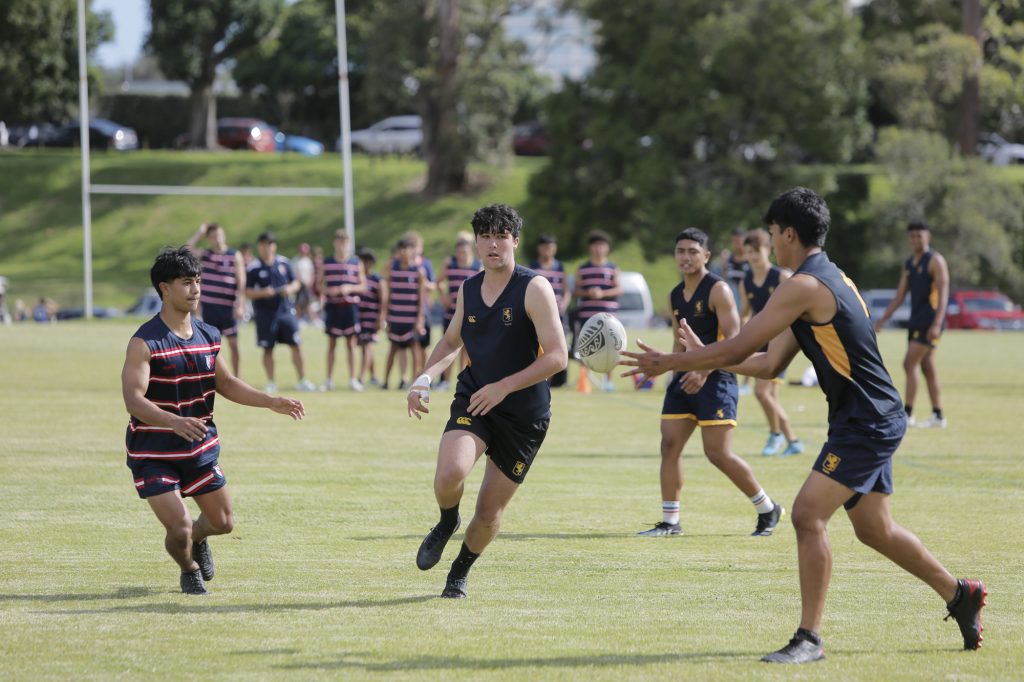 Cruz Kumeroa (centre) waits for the intercept in the team's game against Kelston Boys' High School